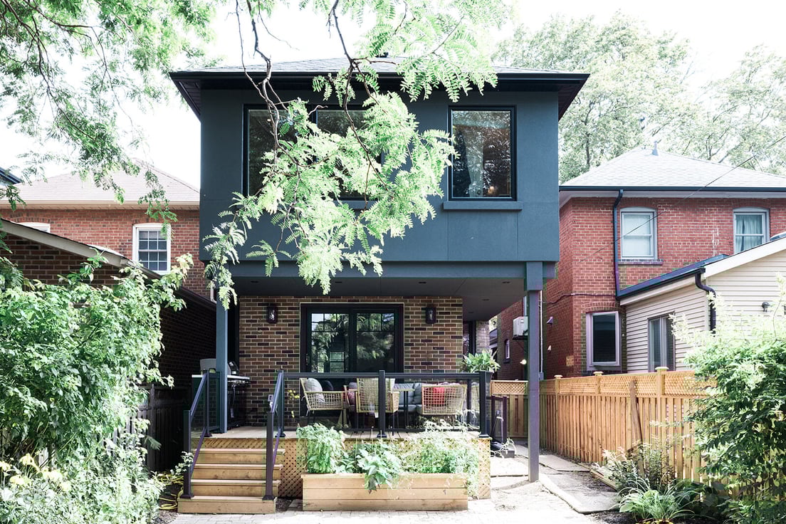 Bedford_Park_Home_Addition-56-ExteriorViewOfBackAdditionWithBackyardDeckAndBasementWalkout